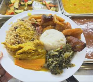 Plate of food from caribbean buffet.