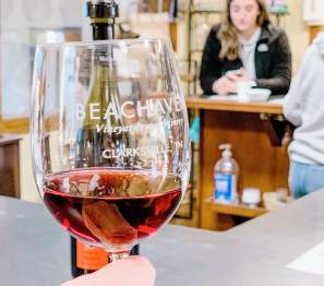 holding a glass of wine