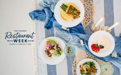 Overhead table of food with a Port Aransas Restaurant Week overlaid on the left