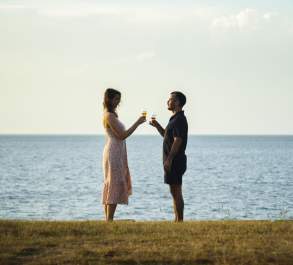 Couple standing by waterfront