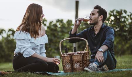 A couple enjoying a picnic at Little Wold Vineyard in East Yorkshire