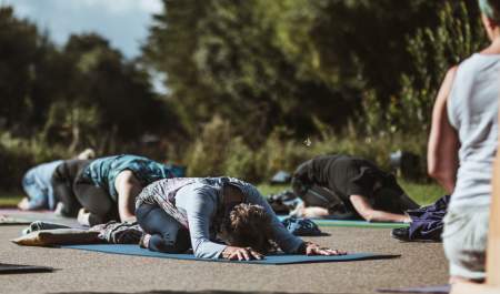 A group of people taking part in outdoor yoga in East Yorkshire
