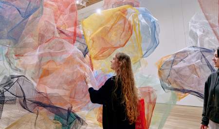 Girl touching art gallery installation in Birmingham