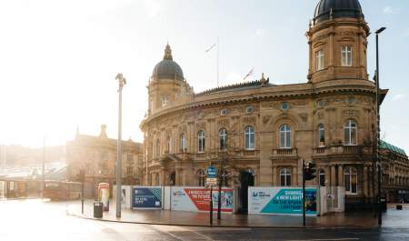 Hull Maritime Museum exterior with ornate historic architecture and colourful flower displays on a sunny day