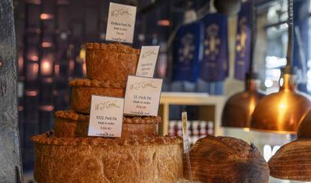 Display of different size pork pies to order in WJ Castle in Burford