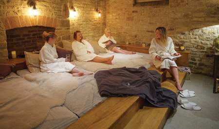 A group of ladies chatting and relaxing at The Vaulted Spa at the Kings Head Hotel in the Cotswolds