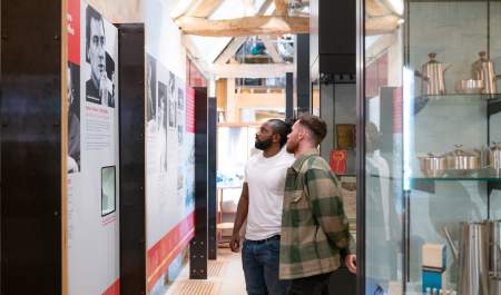 Two men looking at exhibits at Court Barn Museum