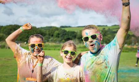 family covered in coloured paint