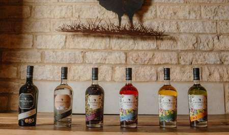 A line of Cotswold Distillery bottles of whisky