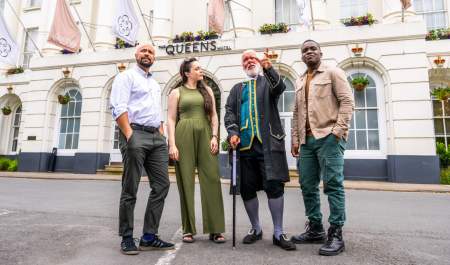 Group tour Cheltenham. Group stood outside the Queens Hotel Cheltenham with tour guide Phil from Cheltenham Promenaders.