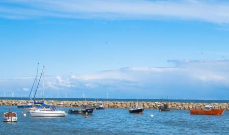 View of sailing boats on the water at Rhos-on-Sea