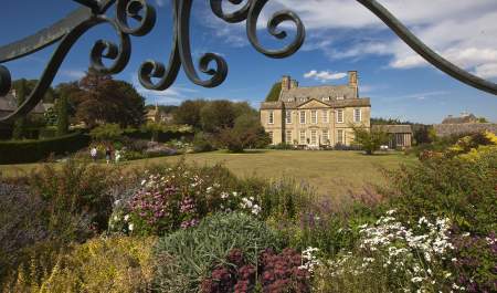 Summer view towards Bourton House across the garden