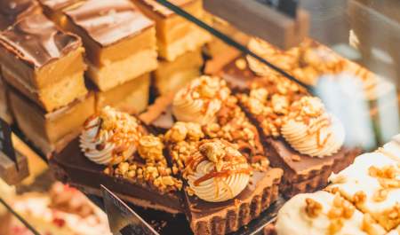 Cakes and tarts in the display cabinet at The Kitchen, Howden in East Yorkshire