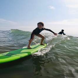Learn to surf at the Wave Riding School