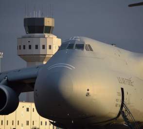 USAF plane with tower in background at Salina Regional Airport