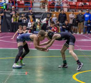 Two kids wrestling at the Tournament of Champions 2026, at Tony's Pizza Event Center in Salina, Kansas