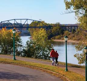 couple walking along the river