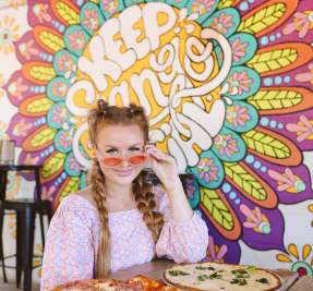 enjoying pizza at The Thirsty Goat