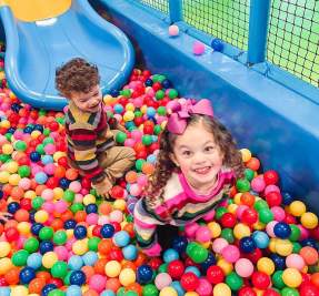 kids in a bubble cage