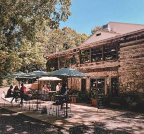 patio dining tables outside of a historic restaurant