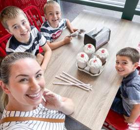 boys and mom with milkshakes and smiles