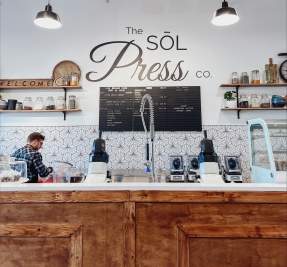 Employees prepare orders at The Sol Press Co. in Sango