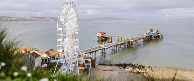 Large Ferris wheel next to Mumbles pier