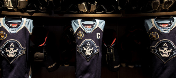 A close up of the Milwaukee Admirals jerseys within the locker room