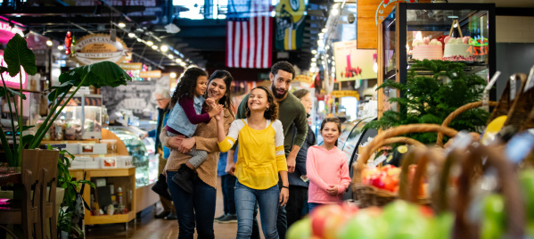 a family walking through the Milwaukee Public Market