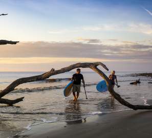 Paddleboarding along Driftwood Beach on Jekyll Island is especially popular during sunrise