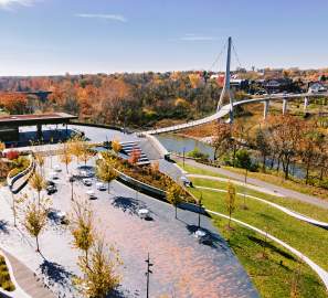 Riverside Crossing Park and the Dublin Link pedestrian bridge surrounded by fall color.
