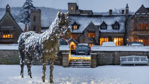 Ellenborough Park glows with lights, surrounded by a blanket of snow