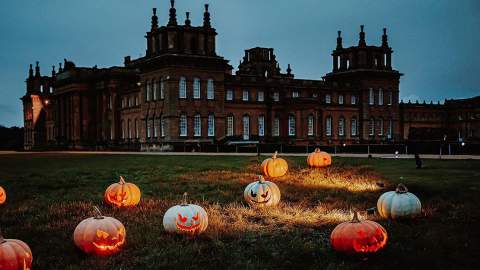Lit pumpkins are scattered in front of Blenheim Palace in the Cotswolds