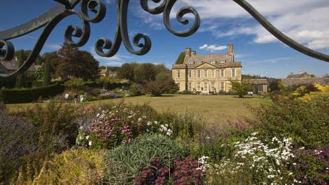 Summer view towards Bourton House across the garden
