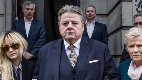 Robbie Coltrane starring in National Treasure with Julie Walters. Robbie stands in a suit outside the Guildhall in Hull to film a court scene.