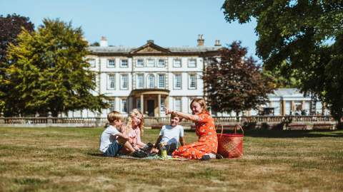 An image of a family enjoying a picnic out Sewerby Hall and Gardens.