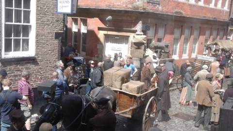 A film set in Hull's old town area with a horse and carriage and extras dressed in victorian era costumes.