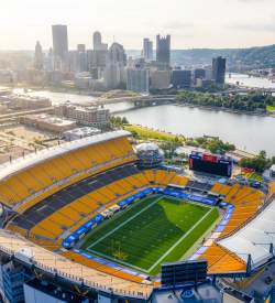 Birds eye view of Acrisure Stadium in Pittsburgh with the skyline in the background