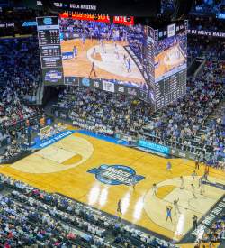 Aerial view of a basketball game being played at Xfinity Mobile Arena in Philadelphia with people in the stands
