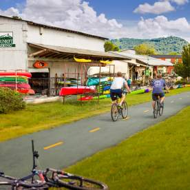 Exterior view of the Swamp Rabbit Trail in front of Sunrift Adventures shop.