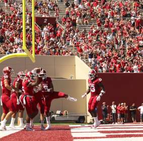 Hoosiers celebrating a touchdown on the field