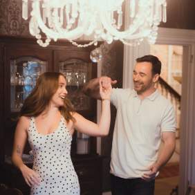 Couples dancing in a dining room