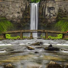 bridge in front of waterfall