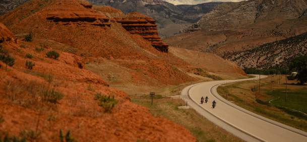 Two Motorcycles navigating along a winding road in Big Horn County Wyoming