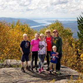 family on mountain top in Fall