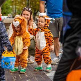 Children in costume gather for Halloween activities.