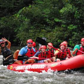 A group takes on the waves during a white-water rafting trip near Gatlinburg, TN.