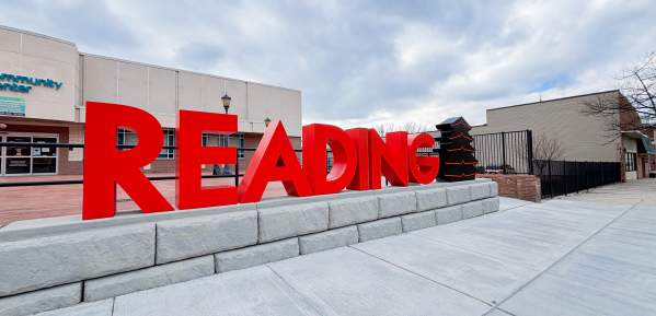 Red Reading sign with pagoda at the end. New art installation downtown