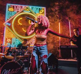 Melat performing at Cheer Up Charlie's