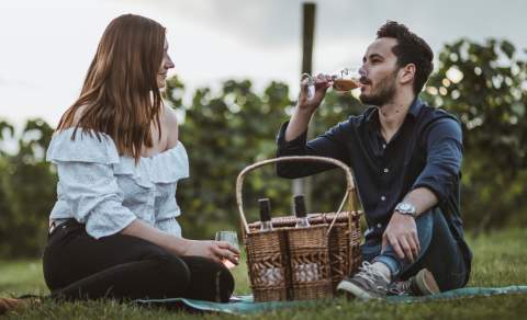 A couple enjoying a picnic at Little Wold Vineyard in East Yorkshire